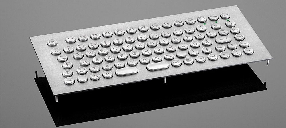  Vandalismusgeschützte Edelstahltastatur 86T-ES mit Trackball und im Gehäuse erhältlich. In allen Ländervarianten erhältlich. 