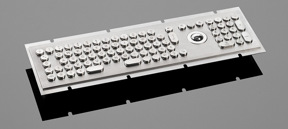  Clavier anti-vandale de 82 touches avec trackball de 25 mm intégrée (disponible en option de montage). Résiste à la poussière et aux projections d'eau. 